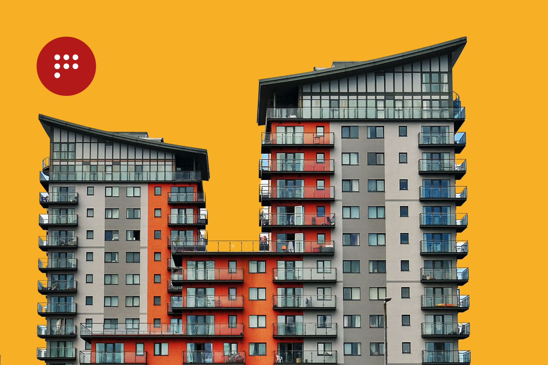 Edificio de apartamentos de varios niveles en tonos grises y rojos bajo fondo rojo logotipo propiedadespunto, servicios de administración de propiedades disponibles